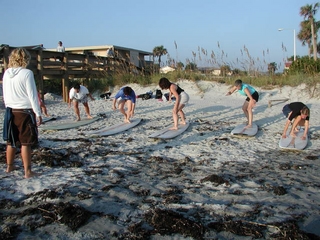 Cowgirls practice their pop-ups on the beach